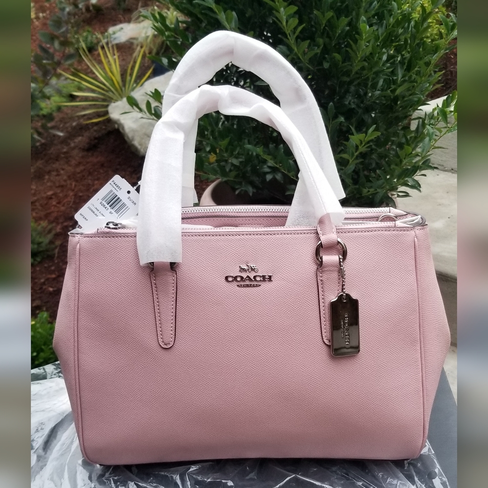Coach large Surrey Carryall in carnation pink.